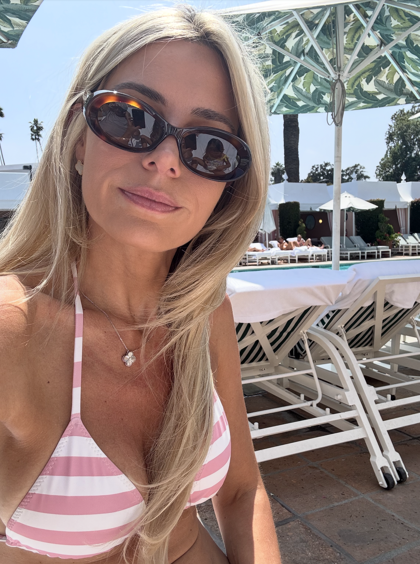JoAnna sitting poolside